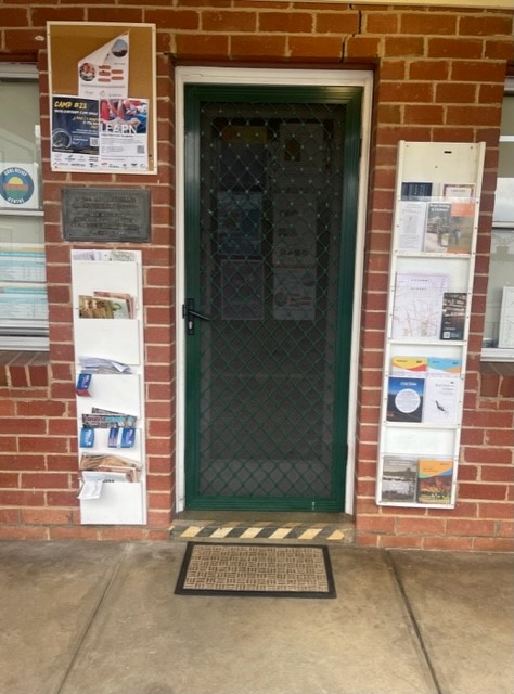 Step at doorway to brick building.