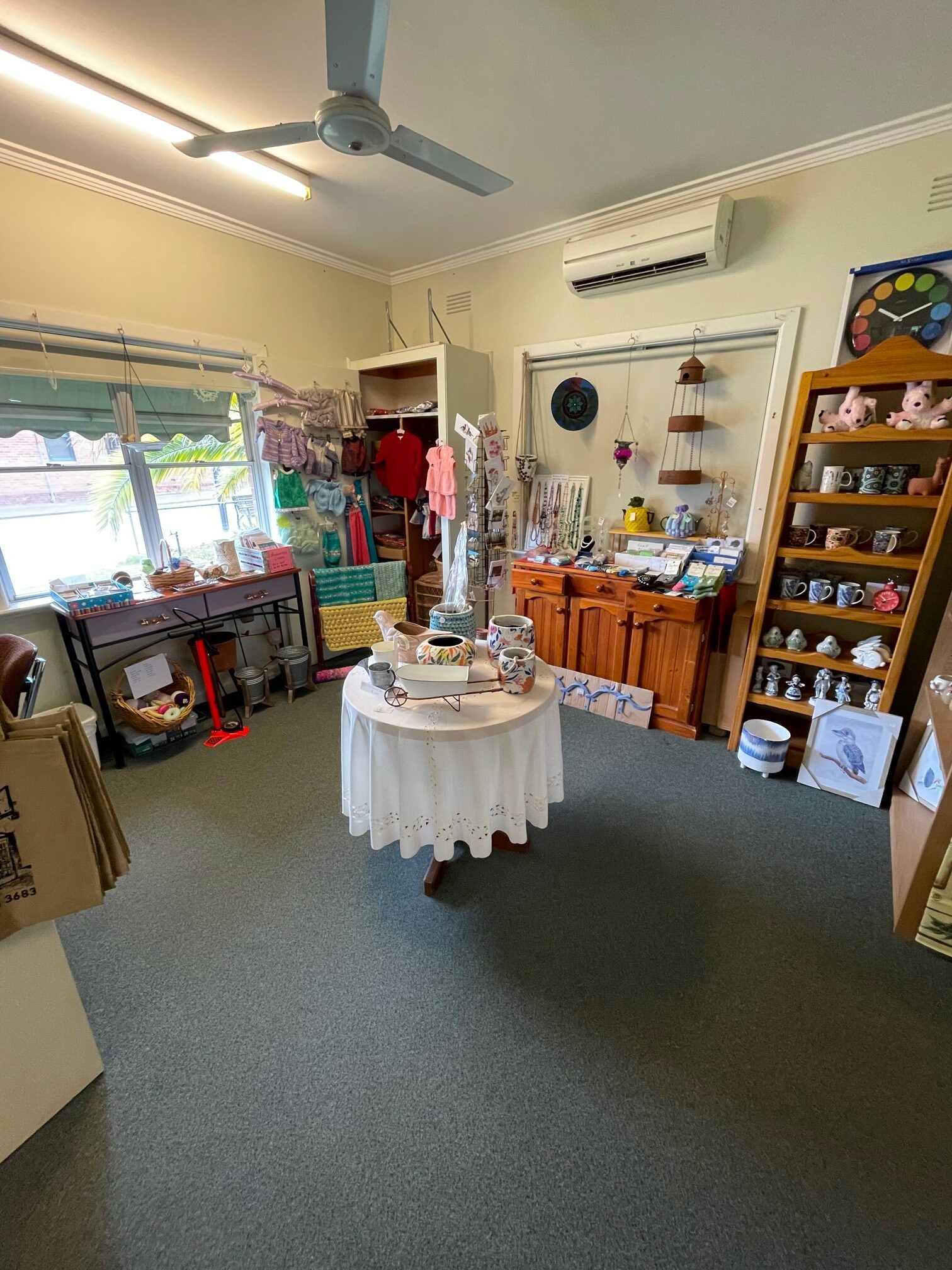 A small round table sits in the middle of the Chiltern Visitor Information Centre.