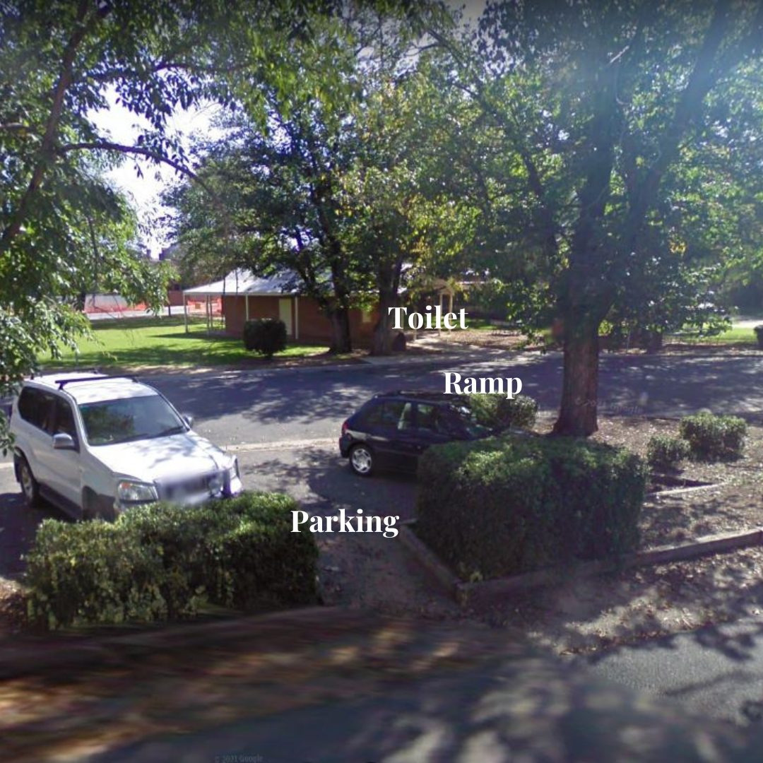 Car park in Chiltern showing parking, ramp access to public toilets.